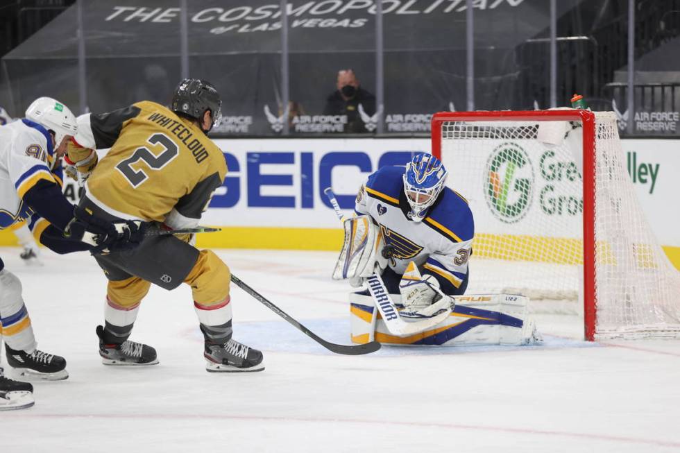 St. Louis Blues goaltender Ville Husso (35) defends a shot by Vegas Golden Knights defenseman Z ...