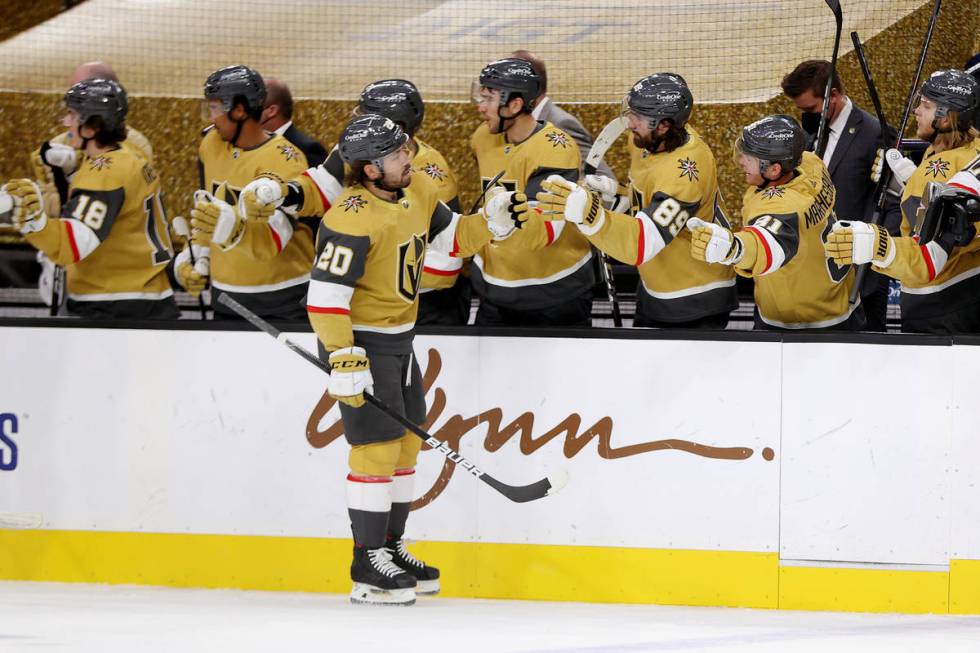 Vegas Golden Knights center Chandler Stephenson (20) celebrates his goal with his team during t ...