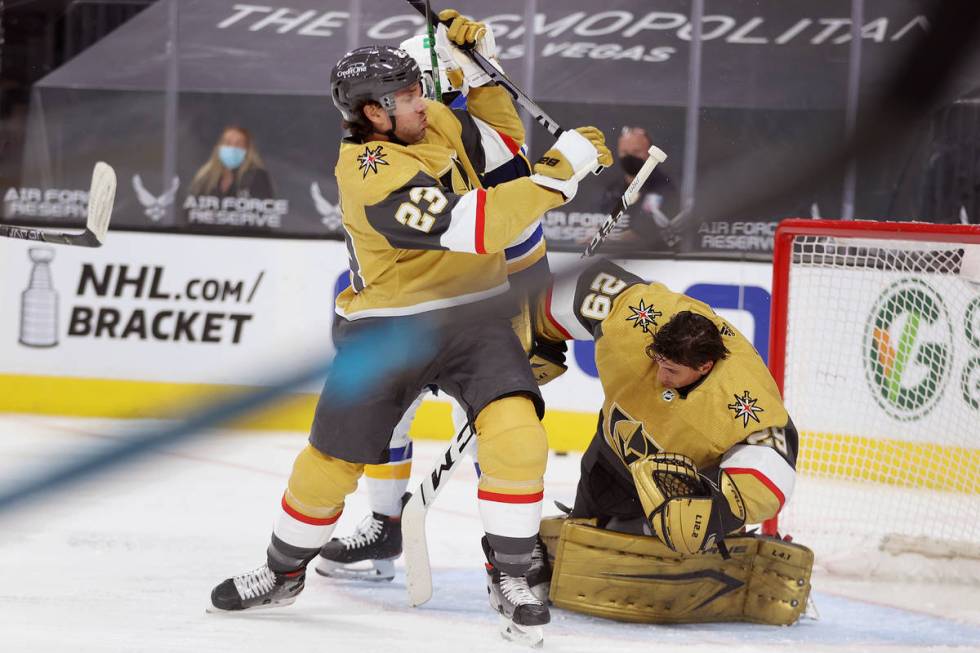 Vegas Golden Knights goaltender Marc-Andre Fleury (29), with defenseman Alec Martinez (23), get ...