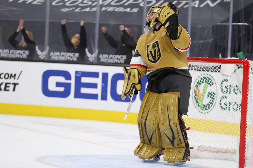 Vegas Golden Knights goaltender Marc-Andre Fleury (29) raises his arm after a goal by right win ...