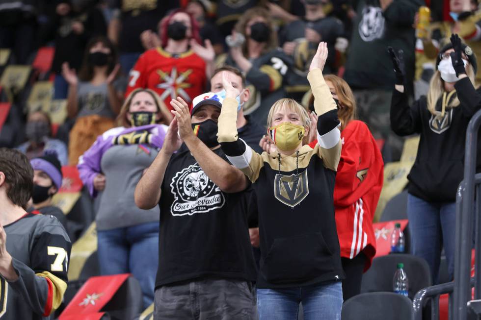 Fans celebrate a score by the Vegas Golden Knights gains the St. Louis Blues during the third p ...