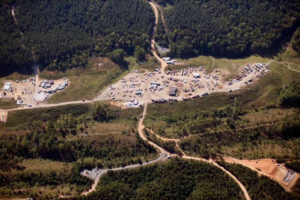 FILE - In this Sept. 20, 2016 file photo vehicles are seen near Colonial Pipeline in Helena, Al ...