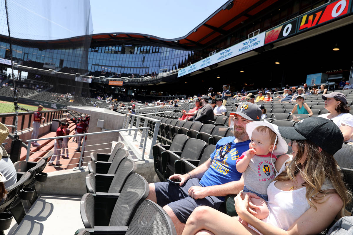 Kelsey Law watches the game with her son Chandler, 11 months, and husband Matt at Las Vegas Bal ...