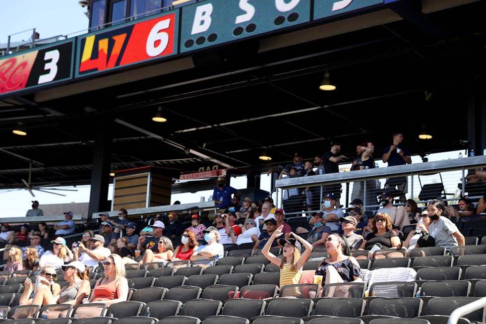 Kayla Cox and her daughter Kira, 10, watch the game at Las Vegas Ballpark as the Aviators take ...