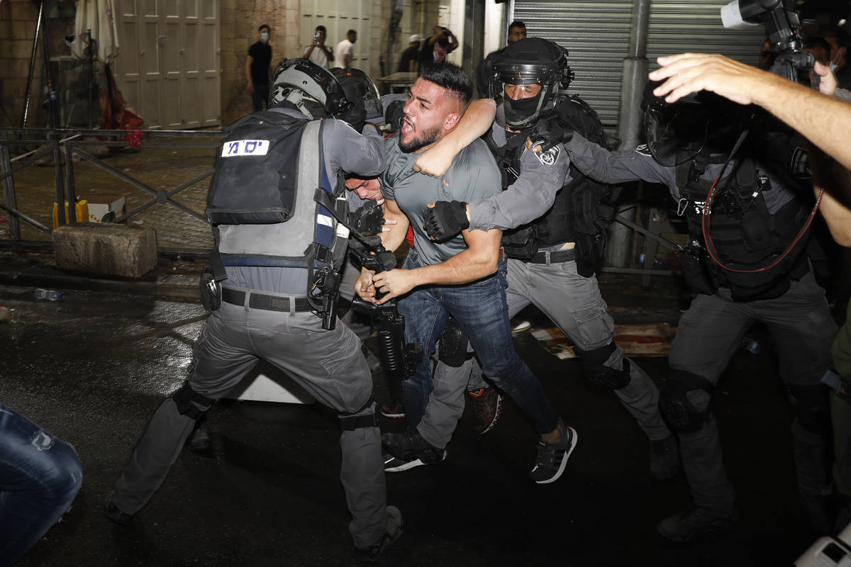 Israeli police officers clash with Palestinian protesters near Damascus Gate just outside Jerus ...