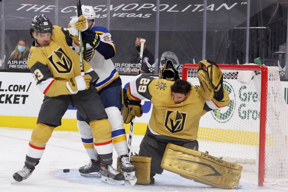 Vegas Golden Knights goaltender Marc-Andre Fleury (29), with defenseman Alec Martinez (23), get ...