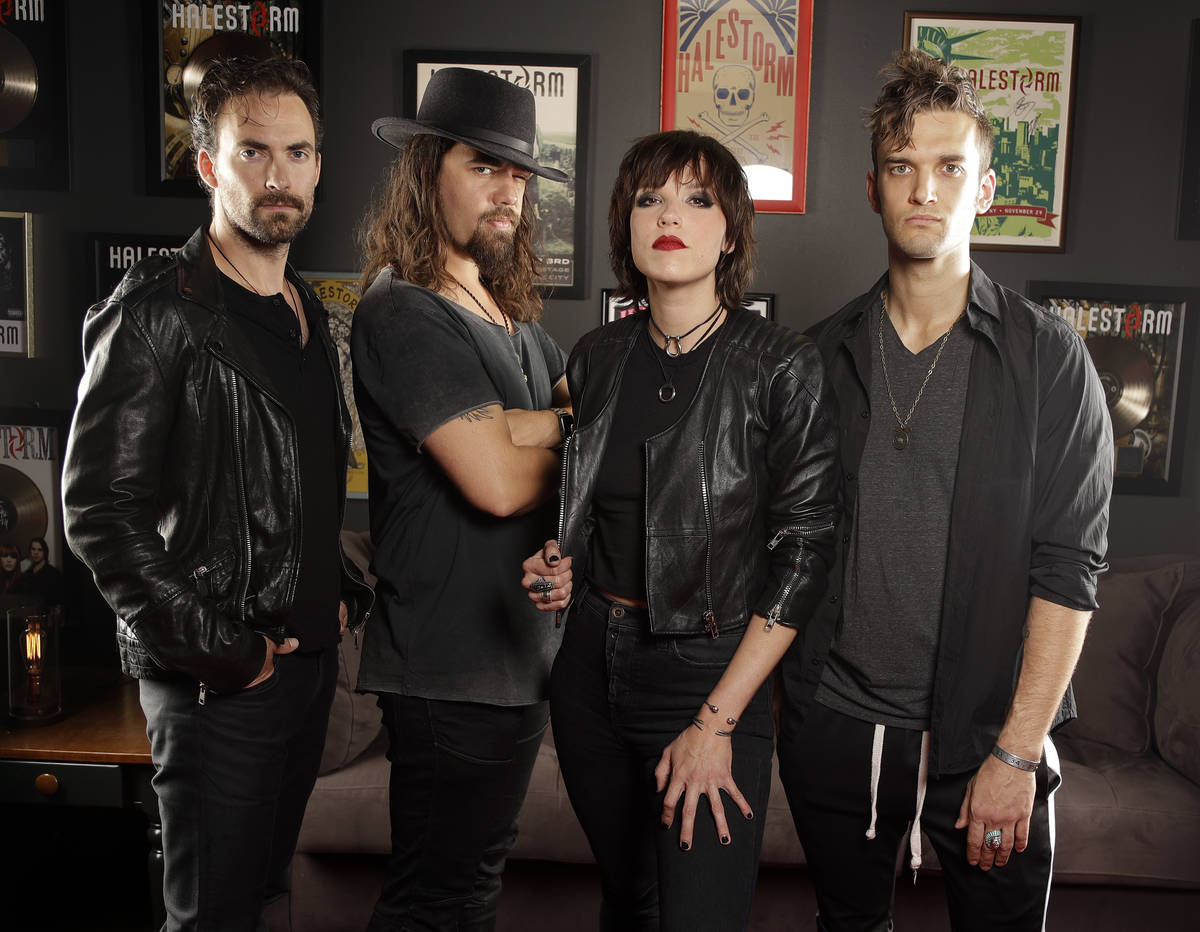 In this July 20, 2018, photo, members of Halestorm, from left, Josh Smith, Joe Hottinger, Lzzy ...