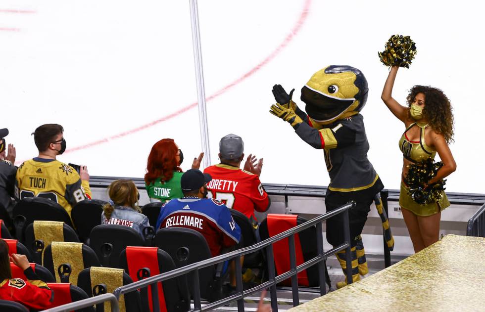 Golden Knights mascot Chance cheers with the crowd during the first period of an NHL hockey gam ...