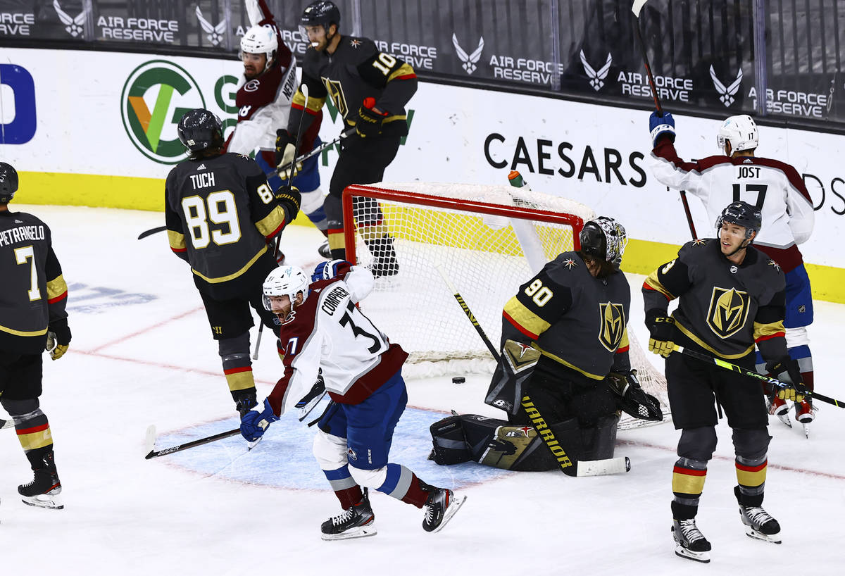 Colorado Avalanche's J.T. Compher (37) celebrates after scoring a goal past Golden Knights goal ...