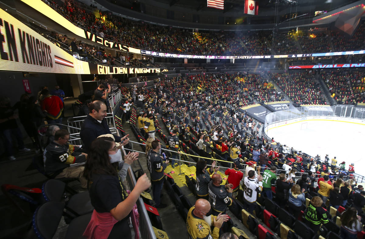 Golden Knights fans cheer before the start of an NHL hockey game against Colorado Avalanche at ...