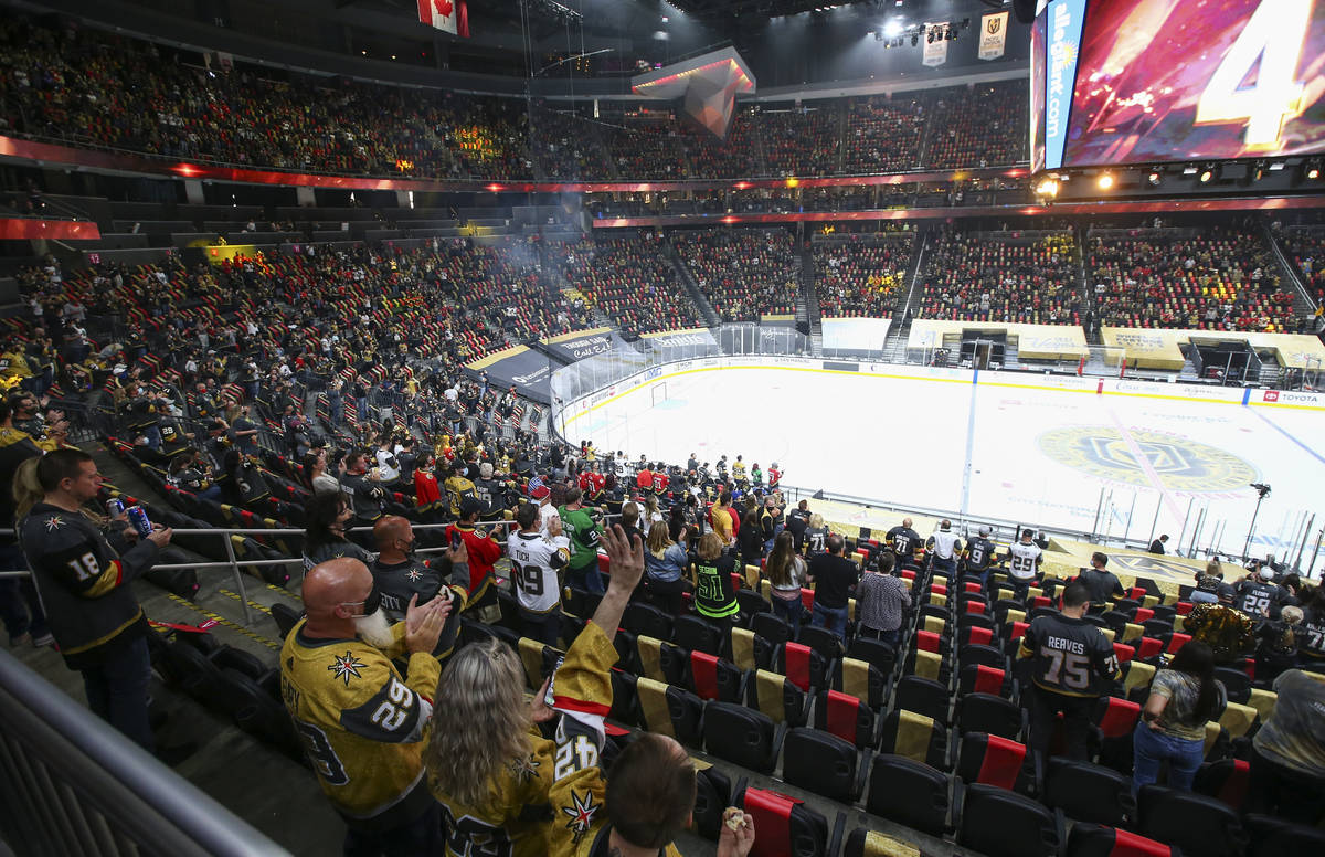 Golden Knights fans cheer before the start of an NHL hockey game against Colorado Avalanche at ...