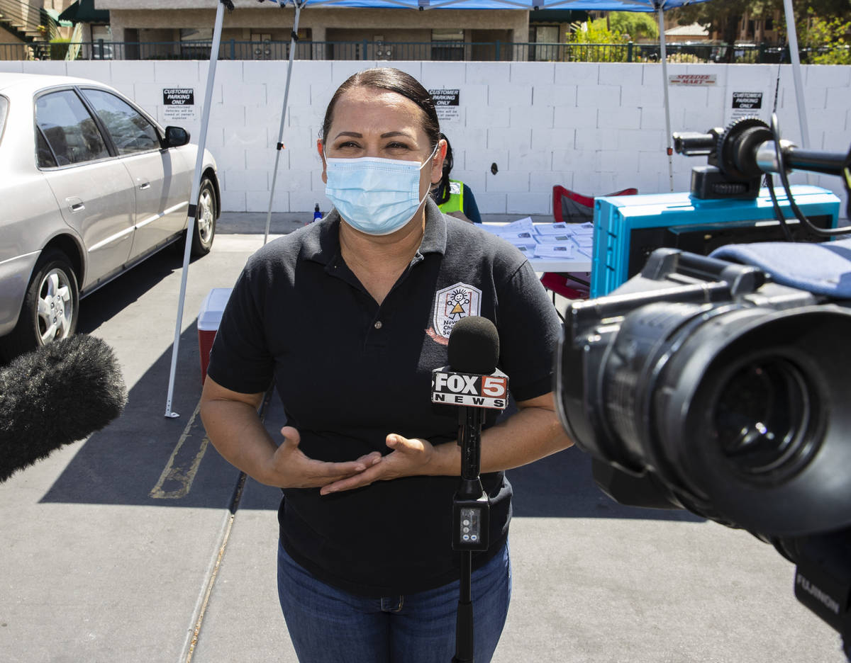 Margarita Edwards, executive director Nevada Child Seekers, addresses the media outside of Emer ...