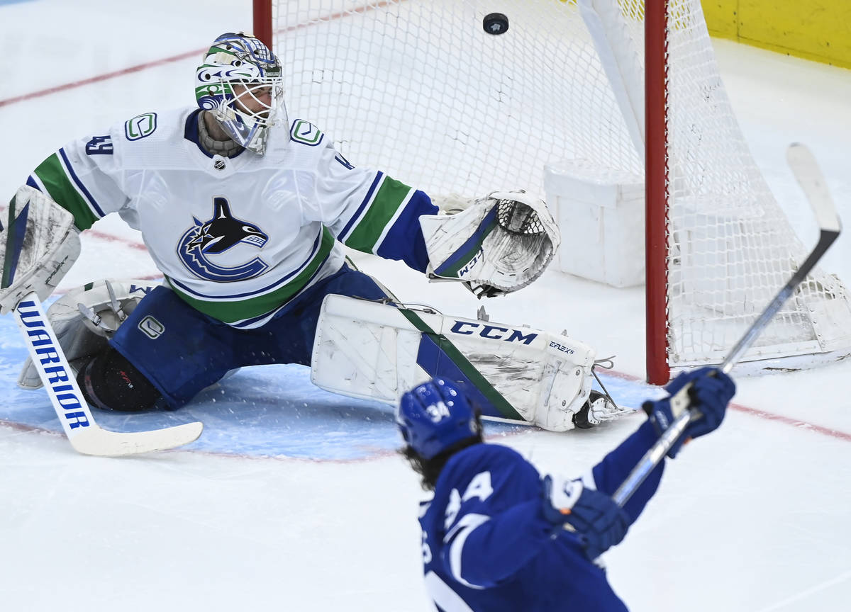Toronto Maple Leafs forward Auston Matthews (34) scores past Vancouver Canucks goaltender Brade ...