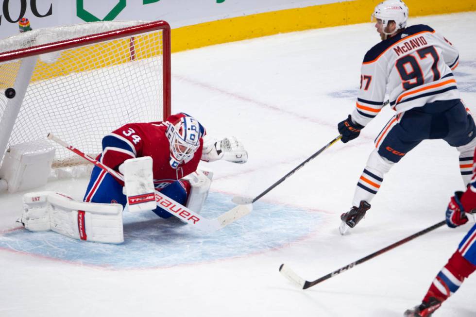 Edmonton Oilers' Connor McDavid (97) scores the winning goal on Montreal Canadiens goaltender J ...
