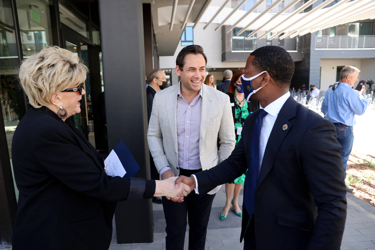 Patrick Brennan, development manager for Aspen Heights Partners, mingles with Las Vegas Mayor C ...