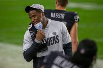 Raiders defensive end Clelin Ferrell pulls down his mask to talk during the first quarter of an ...