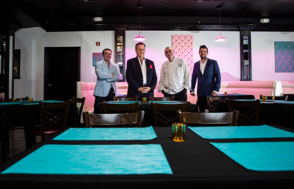 Chef David Robinson, owner of The Nevada Room, third from left, poses with, from left, vice pre ...