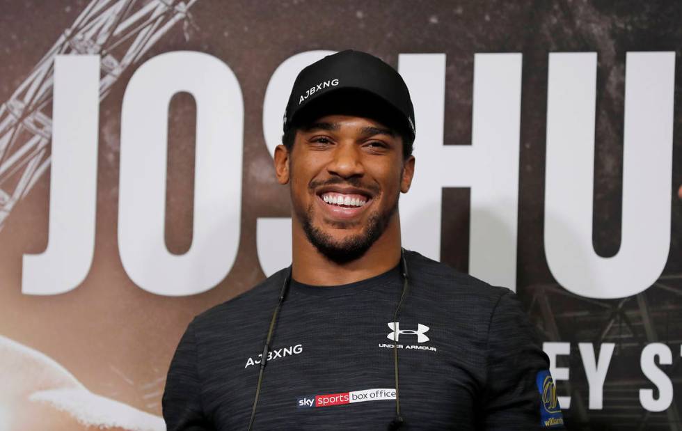 In this Sept. 20, 2018, file photo, Britain's Anthony Joshua smiles during a press conference a ...