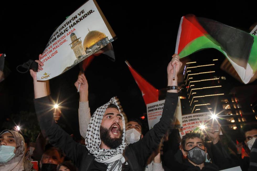 Protesters from IHH, a Turkish pro-Islamic organization chant anti-Israel slogans during a rall ...