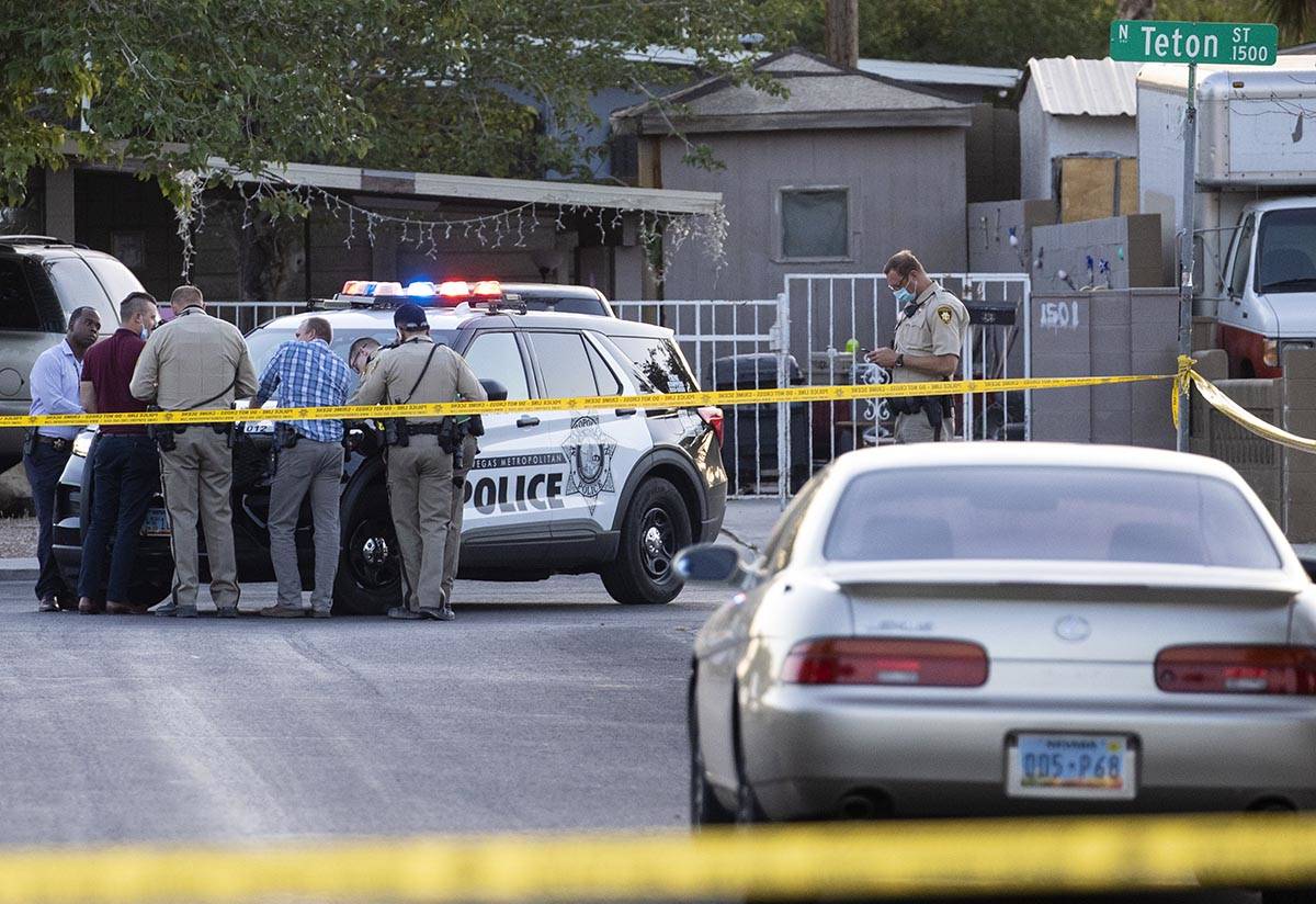 Metropolitan Police Department officers investigate a homicide at the 3200 block of Lava Avenue ...