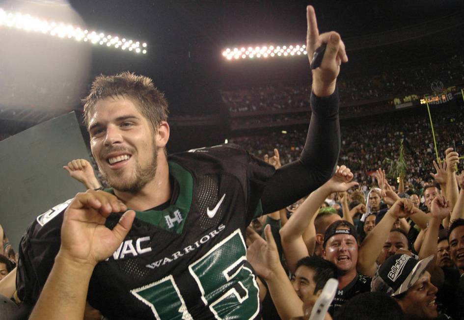 In this Nov. 23, 2007, file photo, then-Hawaii quarterback Colt Brennan celebrates after an NCA ...