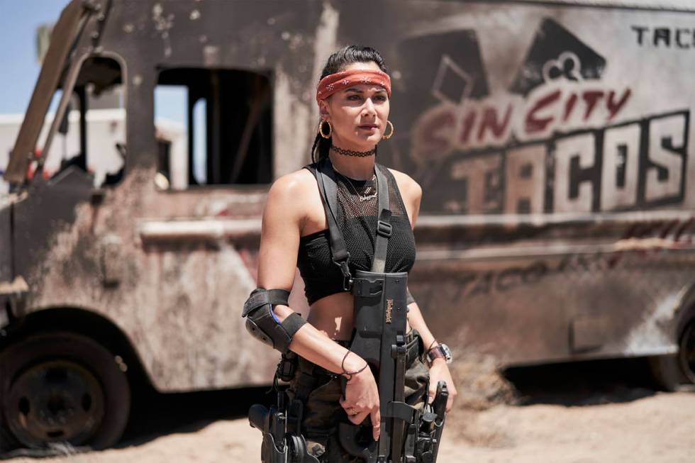 Actress Samantha Win stands in front of a burned out Sin City Tacos truck on the set of "Army o ...