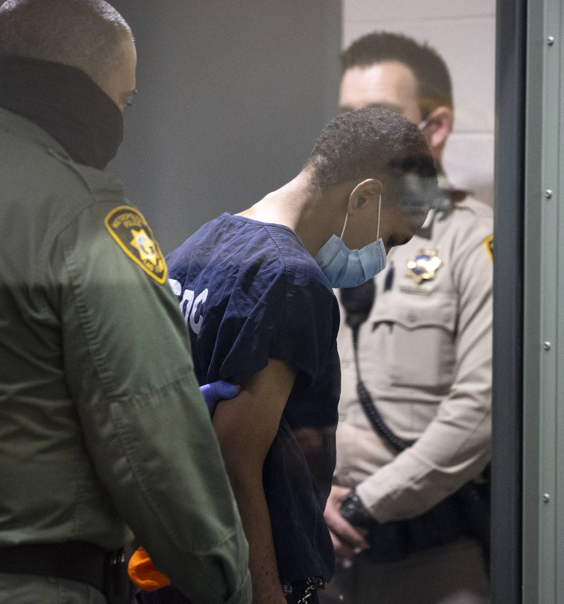 Terrell Rhodes, charged in the death of a 2-year-old boy, Amari Nicholson, is led out of the co ...