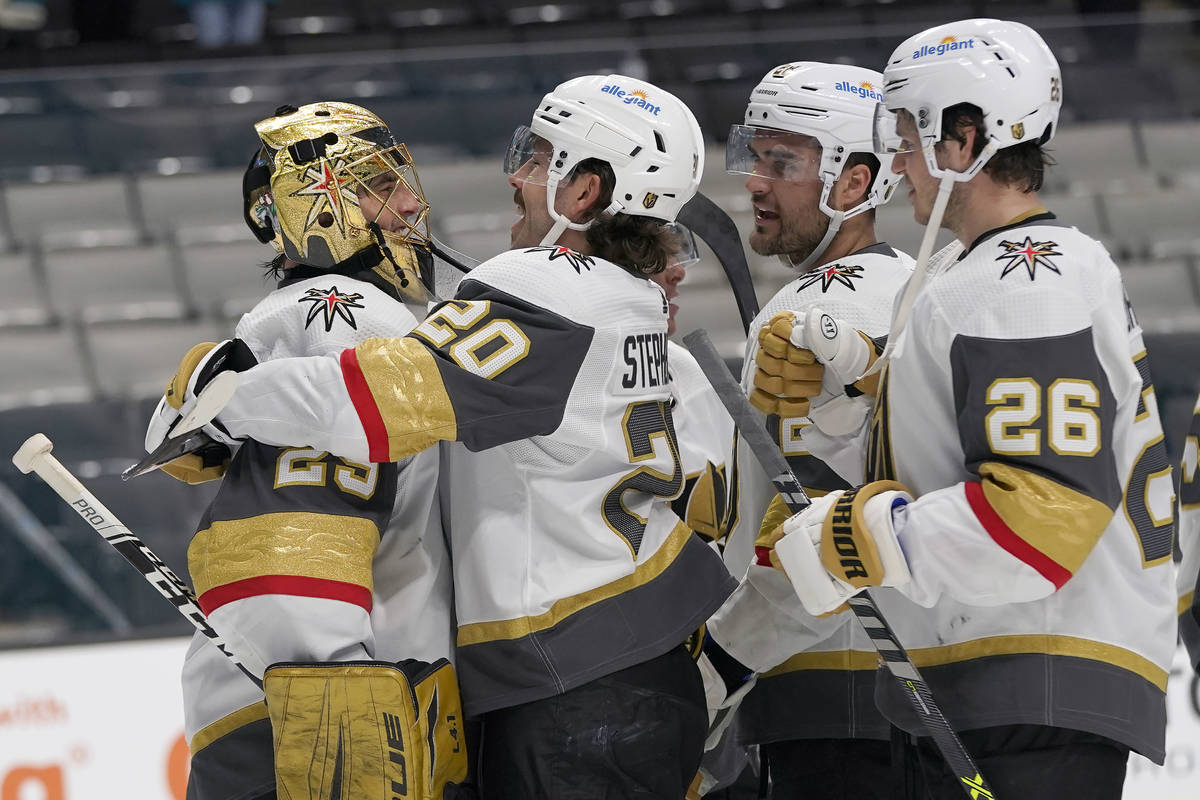 Vegas Golden Knights goaltender Marc-Andre Fleury, left, celebrates with Chandler Stephenson, W ...