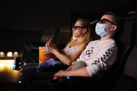 Taylor and Patti Schoffstall of San Diego watch the 4D release of "Godzilla vs. Kong" ...