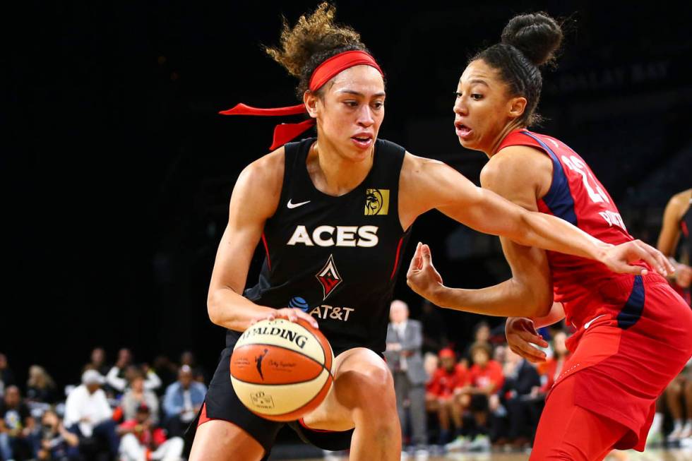 Las Vegas Aces' Dearica Hamby drives to the basket against Washington Mystics' forward Aerial P ...