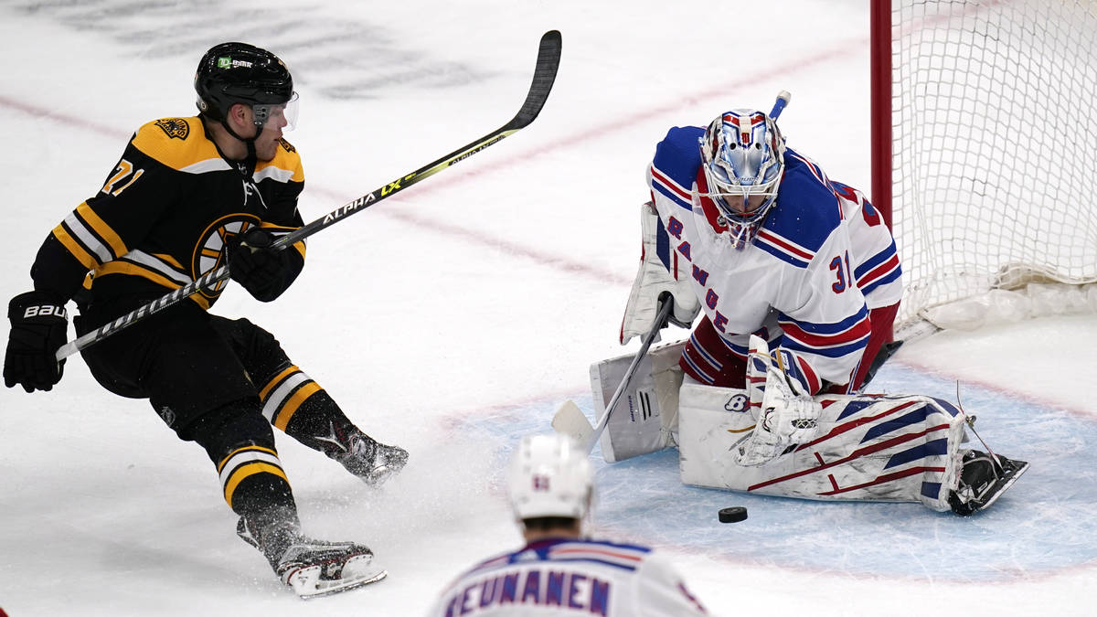 New York Rangers goaltender Igor Shesterkin (31) makes a save on a shot by Boston Bruins left w ...