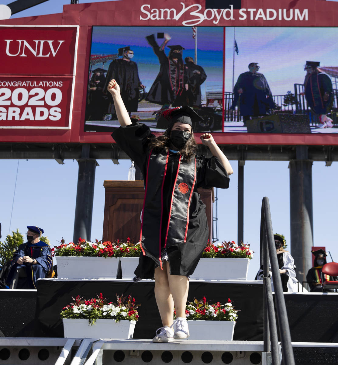 Megan Hastings reacts after receiving her master's in special education during the first of sev ...