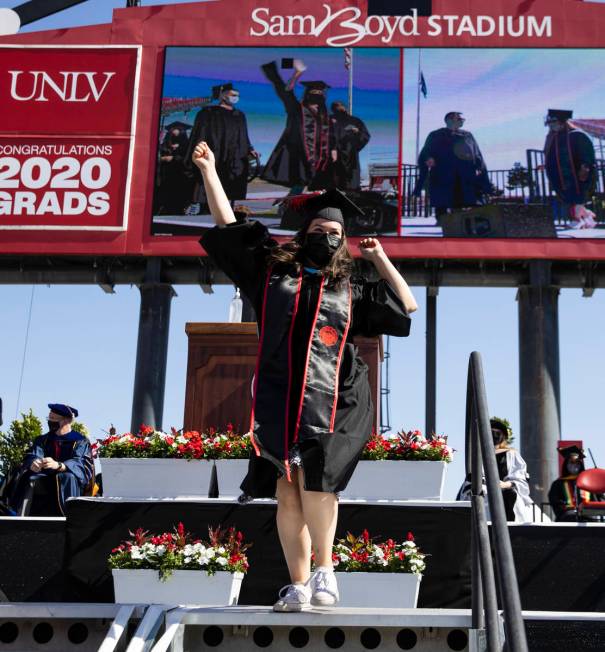 Megan Hastings reacts after receiving her master's in special education during the first of sev ...