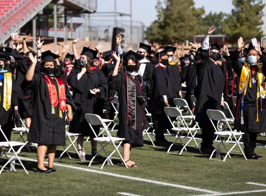 Graduates wave to their parents during the first of several UNLV graduation ceremonies at Sam B ...