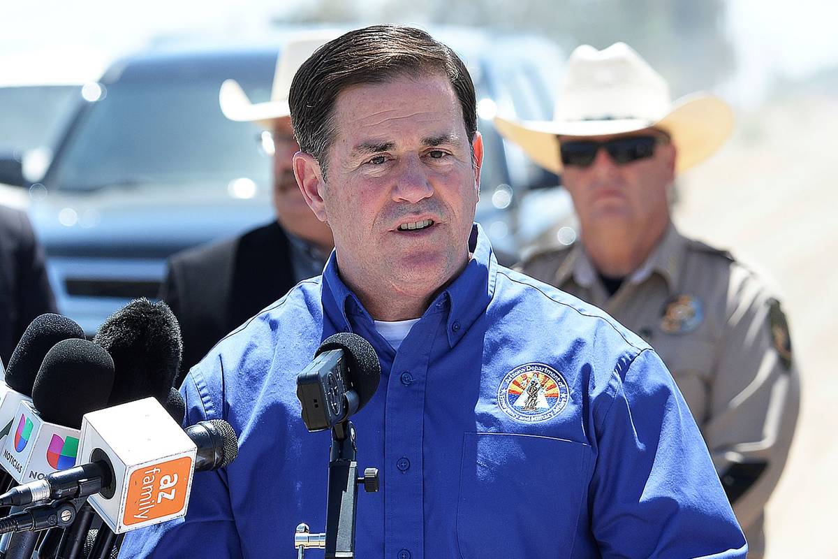 Arizona Gov. Doug Ducey addresses the media at the U.S-Mexico border in Yuma, Ariz., in April 2 ...