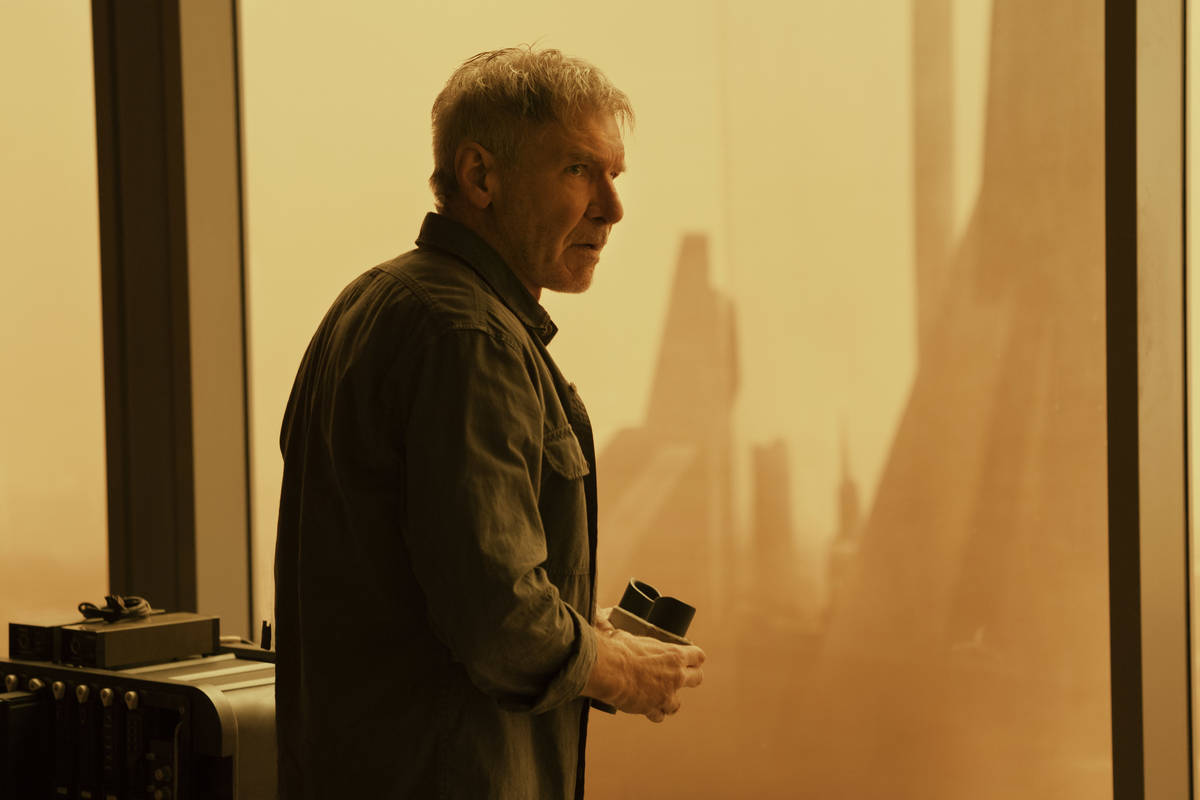 Rick Deckard (Harrison Ford) looks out at an irradiated Las Vegas in "Blade Runner 2049." (Step ...