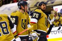 Golden Knights left wing Tomas Nosek (92) and Golden Knights right wing Ryan Reaves (75) look o ...
