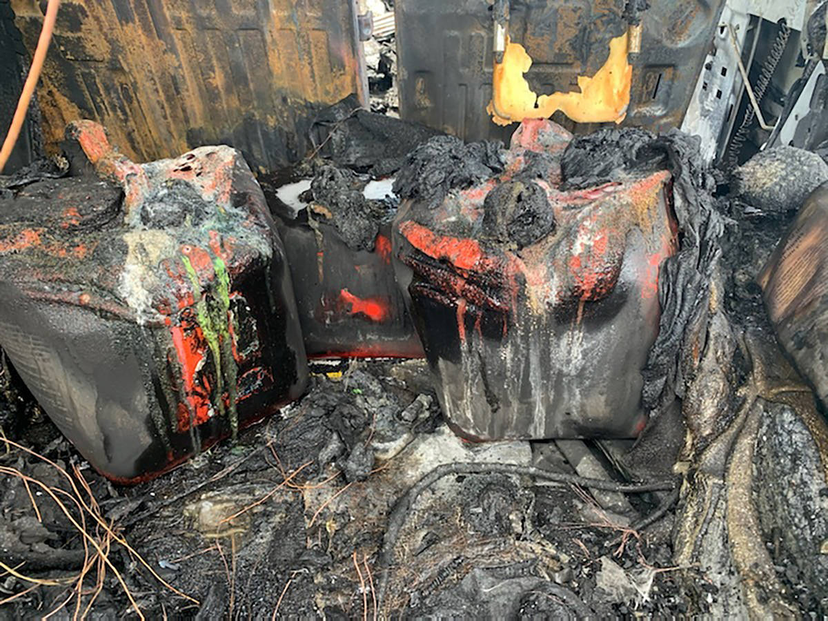 In this photo provided by Citrus County Fire Rescue melted gas cans sit amongst the charred rem ...