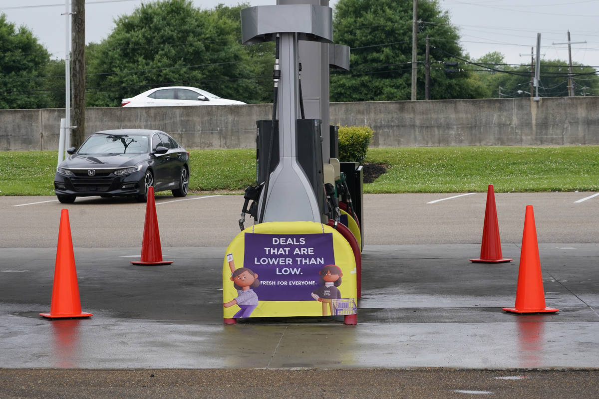 Safety cones block access to the fuel pumps at this closed Kroger fuel station, Wednesday, May ...