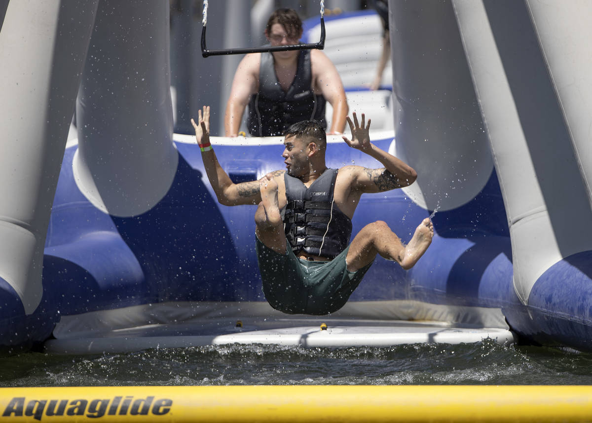 People cool off at the aqua park at Lake Las Vegas Water Sports on Saturday, May 15, 2021 in He ...