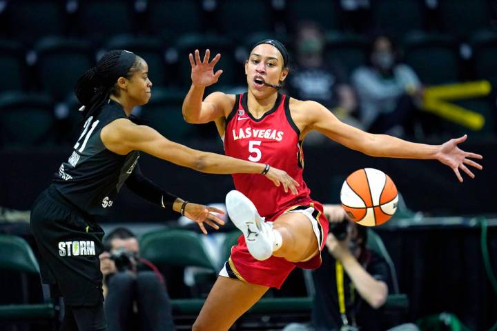 Las Vegas Aces' Dearica Hamby (5) defends against Seattle Storm's Jordin Canada in the first ha ...