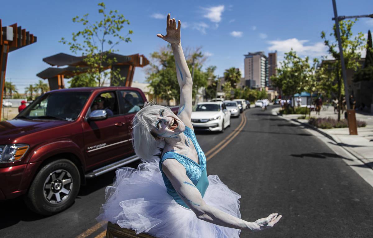 Skin City model Shell Stachowicz dances in front of passing cars during the Las Vegas Days Para ...