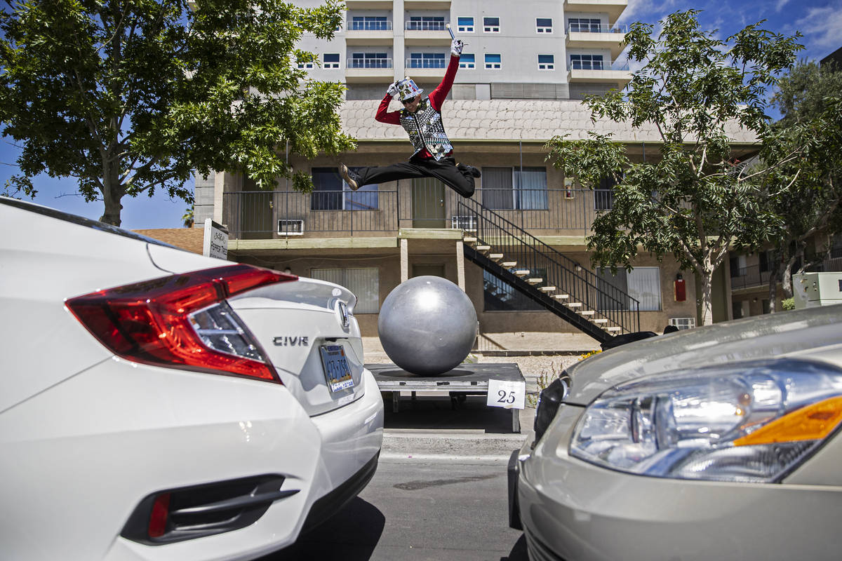Ball walker Dumitru Uzum leaps in the air while performing for passing cars during the Las Veg ...