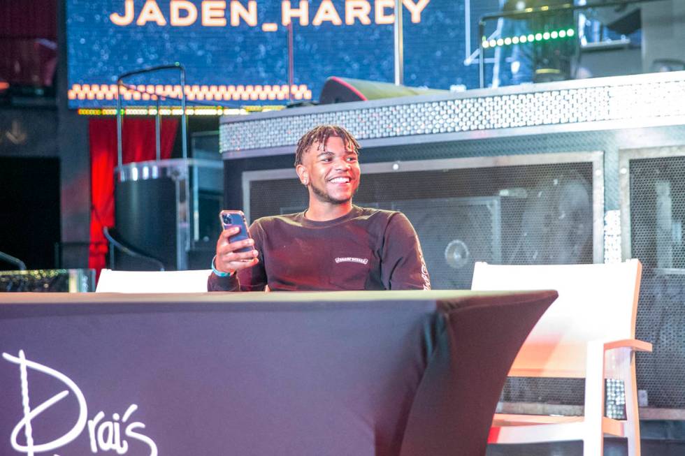 Jaden Hardy, a Coronado High School basketball prospect, streams on his phone at an event to an ...