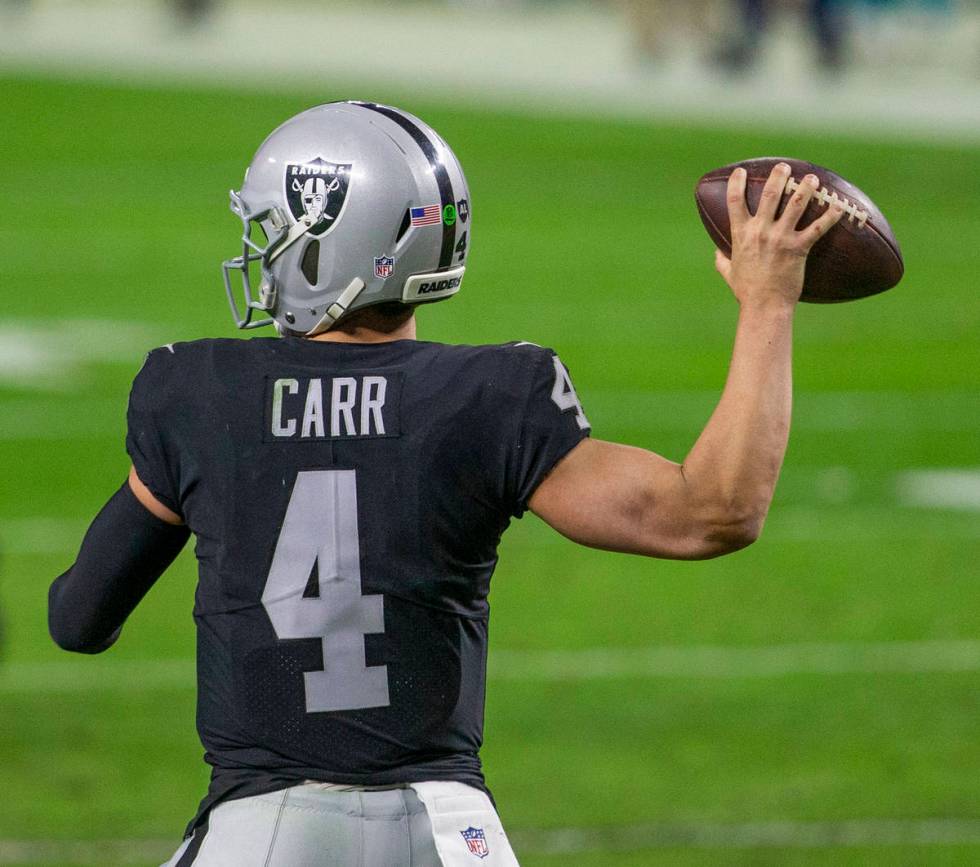 Raiders quarterback Derek Carr (4) throw against the against the Miami Dolphins during the four ...