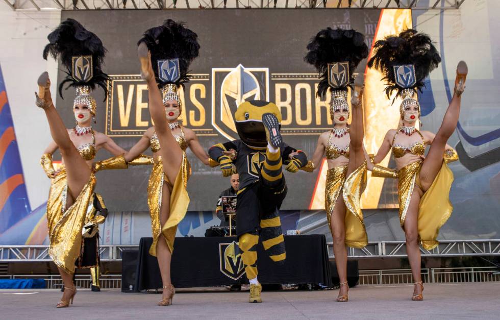 The Vegas Belles and Chance the Gila Monster dance outside before the first period of an NHL pl ...