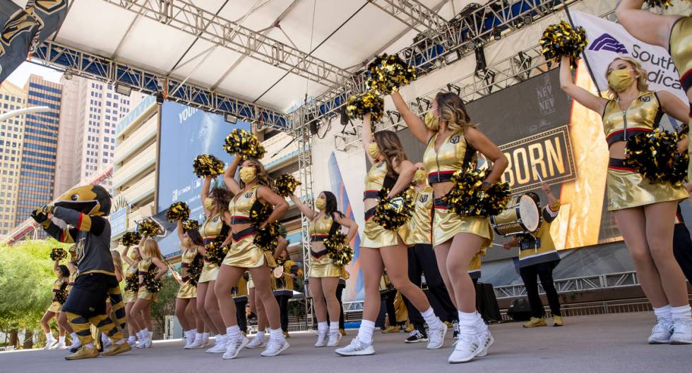 Cheerleaders and Chance the Gila Monster dance outside before the first period of an NHL playof ...