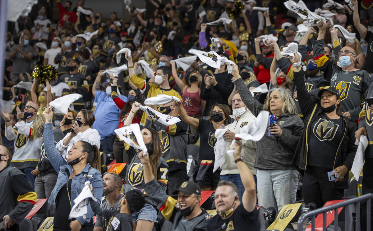 Golden Knights cheer on their team versus the Minnesota Wild during the first period of an NHL ...