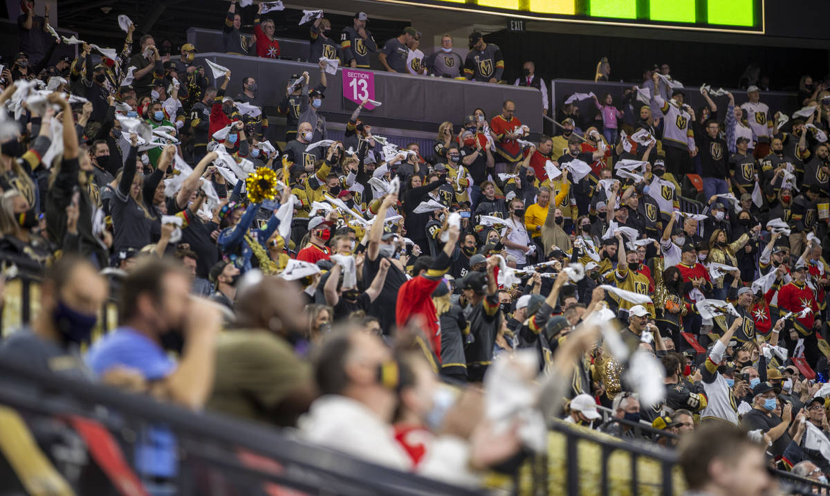 Golden Knights cheer on their team versus the Minnesota Wild during the first period of an NHL ...