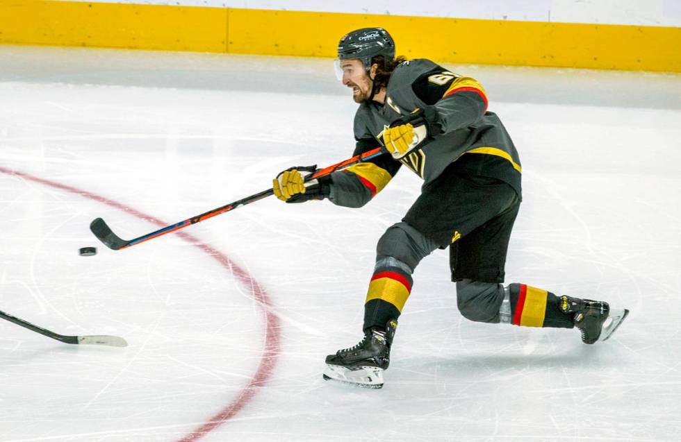 Golden Knights right wing Mark Stone (61) shoots on Minnesota Wild goaltender Cam Talbot (33) d ...